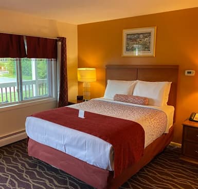 Premium boutique motel bedroom layout with organic design elements